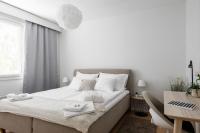 Postel nebo postele na pokoji v ubytování Apartments Borg Dyyni