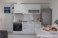 Kuchyň nebo kuchyňský kout v ubytování Hortenzija Apartments