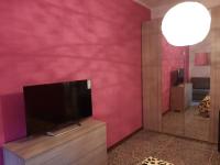 Televízia a/alebo spoločenská miestnosť v ubytovaní FLY HOUSE BOLOGNA...un appartamento al volo