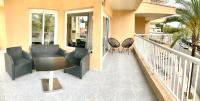 Posedenie v ubytovaní Apartamentos Las Palmeras
