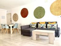 Posedenie v ubytovaní Apartamentos Las Palmeras