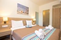 Posteľ alebo postele v izbe v ubytovaní Passas Mare Apartments & Studios