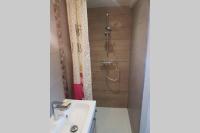 a bathroom with a shower and a sink at VILLA Adrien , maison de charme. in Casanova