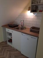 Kuchnia lub aneks kuchenny w obiekcie Gyopár Gyöngye Apartmanház
