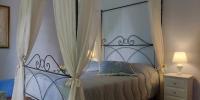 A bed or beds in a room at Il Meriggeto