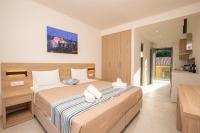 Posteľ alebo postele v izbe v ubytovaní Passas Mare Apartments & Studios