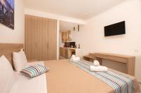 Posteľ alebo postele v izbe v ubytovaní Passas Mare Apartments & Studios