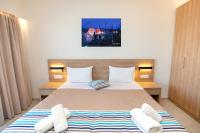 Posteľ alebo postele v izbe v ubytovaní Passas Mare Apartments & Studios