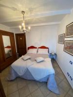 A bed or beds in a room at La casa tra i vigneti