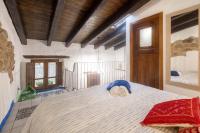 A bed or beds in a room at Casa Masini