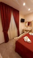 A bed or beds in a room at B&B Orchidea