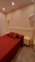 A bed or beds in a room at B&B Orchidea