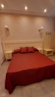 A bed or beds in a room at B&B Orchidea