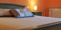 A bed or beds in a room at Il Meriggeto