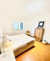 Postel nebo postele na pokoji v ubytování GOLF & BEACH VILLA