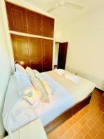 Postel nebo postele na pokoji v ubytování GOLF & BEACH VILLA
