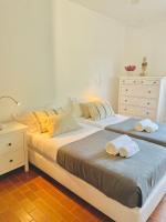 Postel nebo postele na pokoji v ubytování GOLF & BEACH VILLA