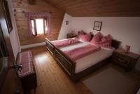 A bed or beds in a room at Almhaus Anita