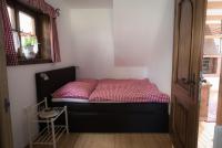 A bed or beds in a room at Almhaus Anita