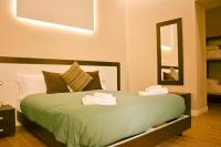 A bed or beds in a room at TheWesley