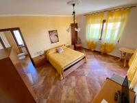 A bed or beds in a room at B&B La Torre