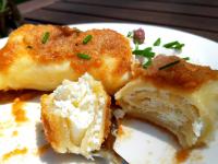 ein weißer Teller mit einem Stück Kuchen mit einer Gabel in der Unterkunft Tesla's Gastro House Plitvice in Plitvička Jezera