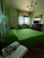 A bed or beds in a room at B&B La Torre