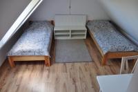 Posteľ alebo postele v izbe v ubytovaní Apartament Stara Leśniczówka