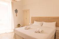 A bed or beds in a room at Casa Labbate
