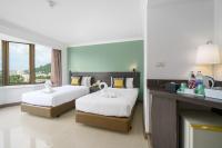 I Pavilion Hotel Phuketにあるベッド