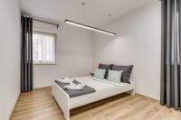 Posteľ alebo postele v izbe v ubytovaní Zielone Apartamenty Katowice Chorzów
