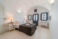Postel nebo postele na pokoji v ubytování Nostos Apartments