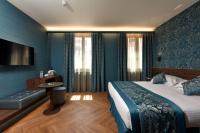 Posteľ alebo postele v izbe v ubytovaní Rosa Salva Hotel
