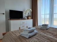 Posteľ alebo postele v izbe v ubytovaní Aqua Apartments Sunset