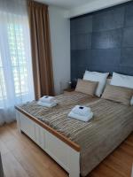 Posteľ alebo postele v izbe v ubytovaní Aqua Apartments Sunset