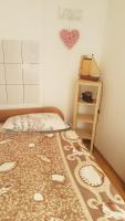 Postel nebo postele na pokoji v ubytování Apartment TIM