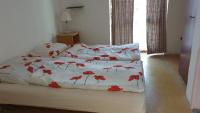 Łóżko lub łóżka w pokoju w obiekcie Aqua Hostel