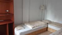 Łóżko lub łóżka w pokoju w obiekcie Aqua Hostel