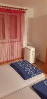 Posteľ alebo postele v izbe v ubytovaní Apartman GRL