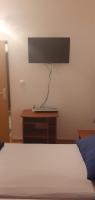 Televízia a/alebo spoločenská miestnosť v ubytovaní Apartman GRL