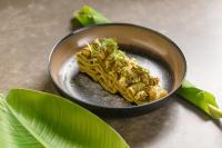 a bowl of food on a table with leaves at Miamar Luxury Hotel & Spa in Himare