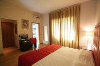 Posteľ alebo postele v izbe v ubytovaní Hotel Piazza Marconi