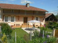 a house with a garden in front of it at Le Clos Fleuri in Caumont