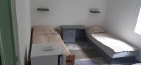 Łóżko lub łóżka w pokoju w obiekcie Aqua Hostel