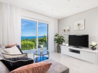 Televízia a/alebo spoločenská miestnosť v ubytovaní Holiday Home Makvic by Interhome