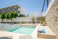 una piscina frente a un edificio en Stay Helios, en Faliraki