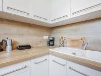 eine Küche mit weißen Schränken und einem Waschbecken in der Unterkunft Apartment La Cité du Lac-4 by Interhome in Saint-Jean-de-Luz
