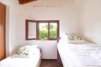 Postel nebo postele na pokoji v ubytování La Casa di Lina - Capo d'Orlando, casa con ampio giardino