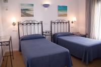 Posteľ alebo postele v izbe v ubytovaní Hostal Alemania