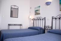 Posteľ alebo postele v izbe v ubytovaní Hostal Alemania